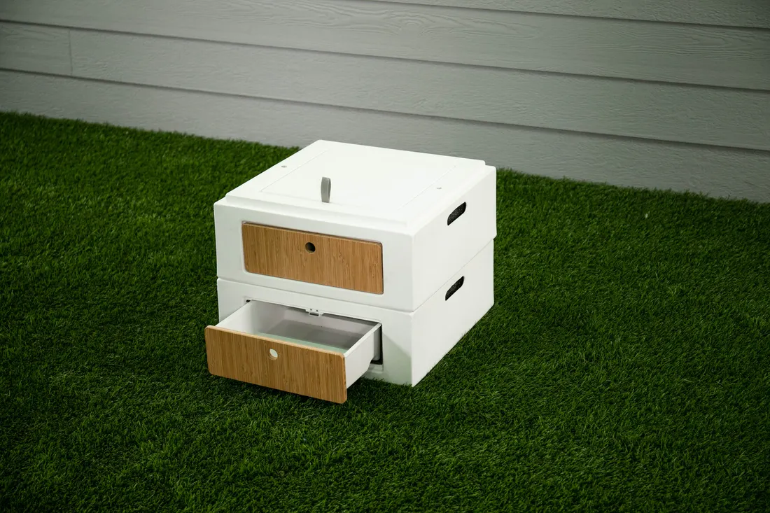 Two stacked half cubes with a drawer